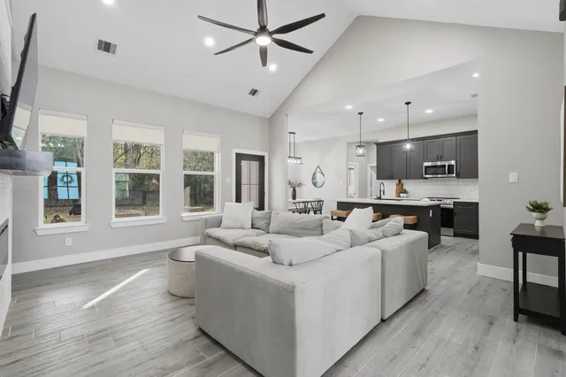 a living room with furniture and a large window
