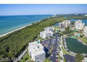 1 Bluebill Avenue, Unit 410 Naples, FL 34108 - Photo 27 of 36 a view of lake with city