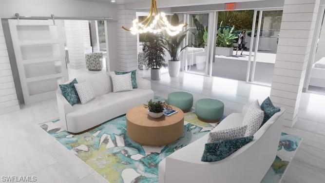 1 Bluebill Avenue, Unit 410 Naples, FL 34108 - Photo 35 of 36 a living room with furniture and a large window