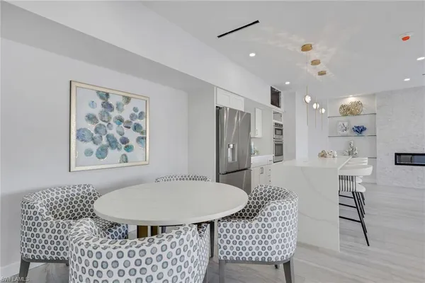 a kitchen with stainless steel appliances kitchen island granite countertop a sink and cabinets