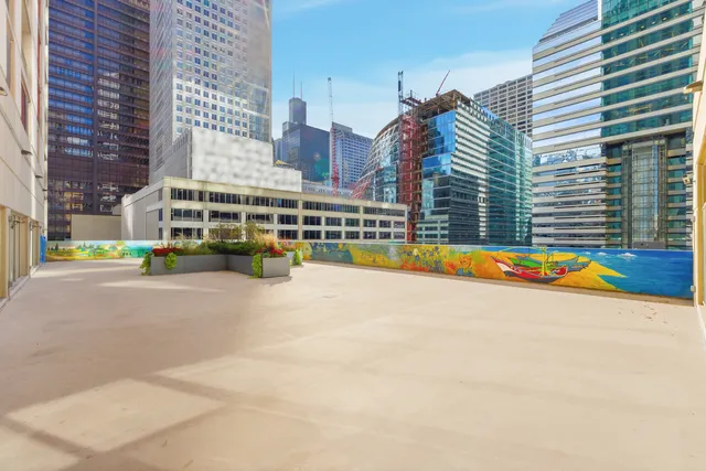 a kitchen with stainless steel appliances granite countertop a sink and a microwave