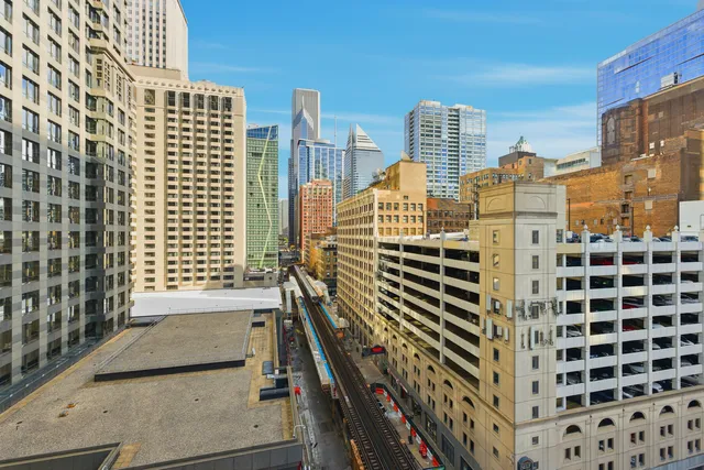 a view of a bathroom with a sink a mirror and a shower