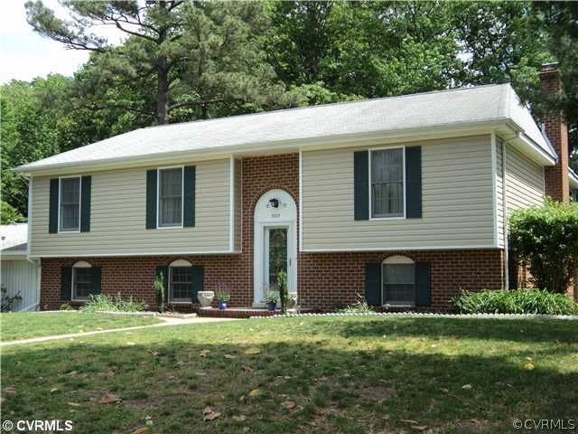 3325 Lancelot Road Petersburg, VA 23805 - Photo 1 of 12 a front view of a house with a garden