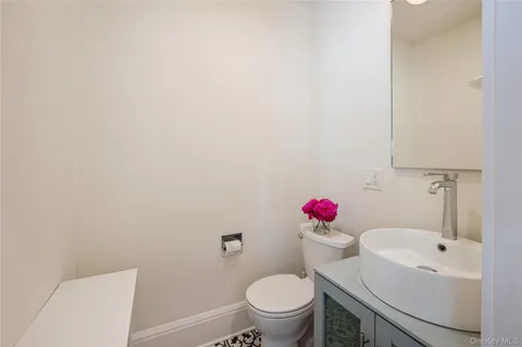 a bathroom with a sink toilet and vanity