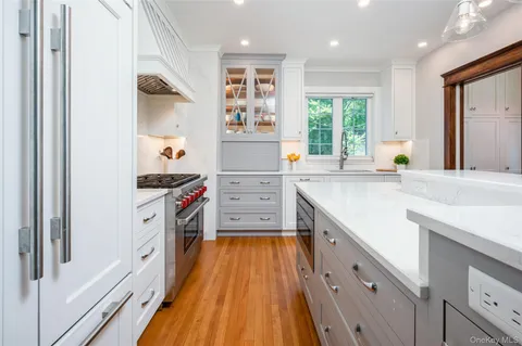 a kitchen with wooden cabinets and a sink