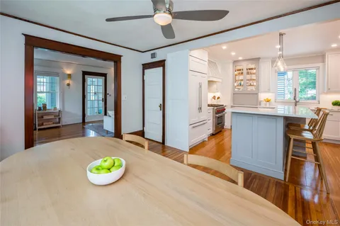 a view of a kitchen with kitchen island and stainless steel appliances