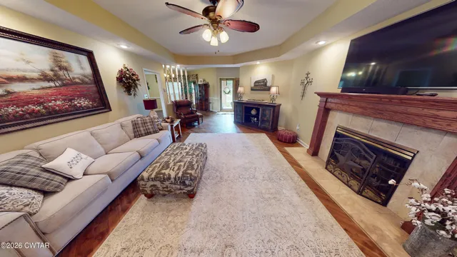 a living room with furniture and a fireplace