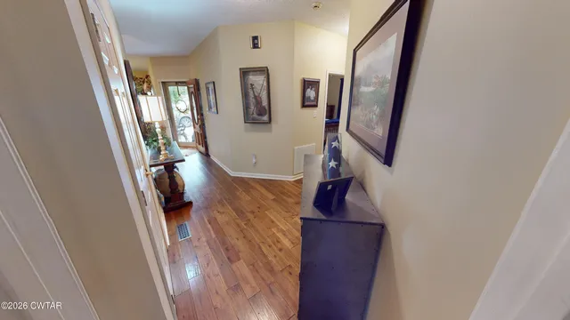 a view of a hallway with windows