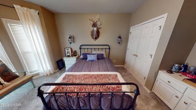 a view of a livingroom with furniture and stairs