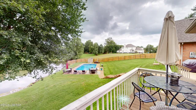 a view of a patio with couches chairs and a potted plant
