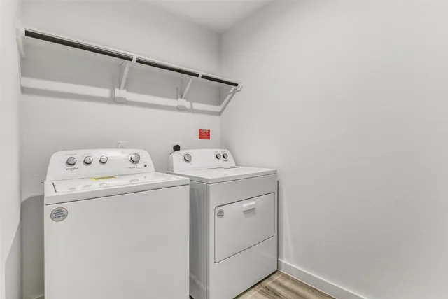 a view of room with a ceiling fan and a window