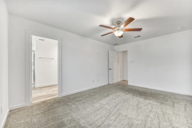 a bathroom with a shower and a window