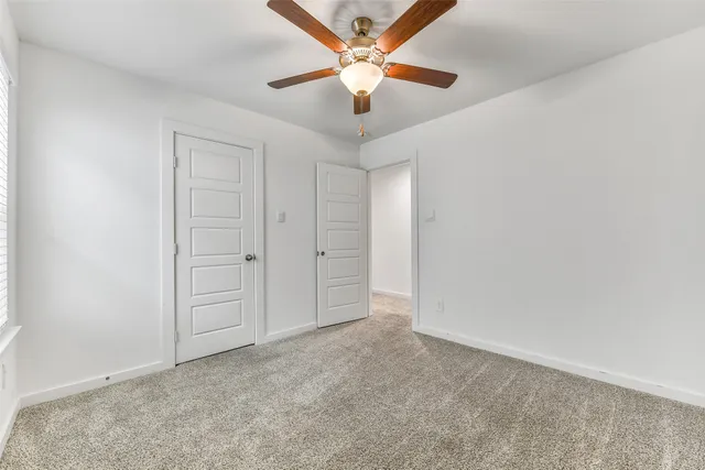 a bathroom with a sink double vanity granite tub shower and a mirror