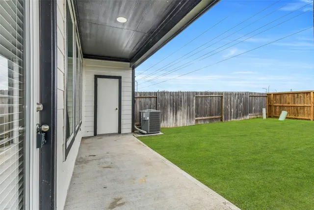 a view of backyard with green space