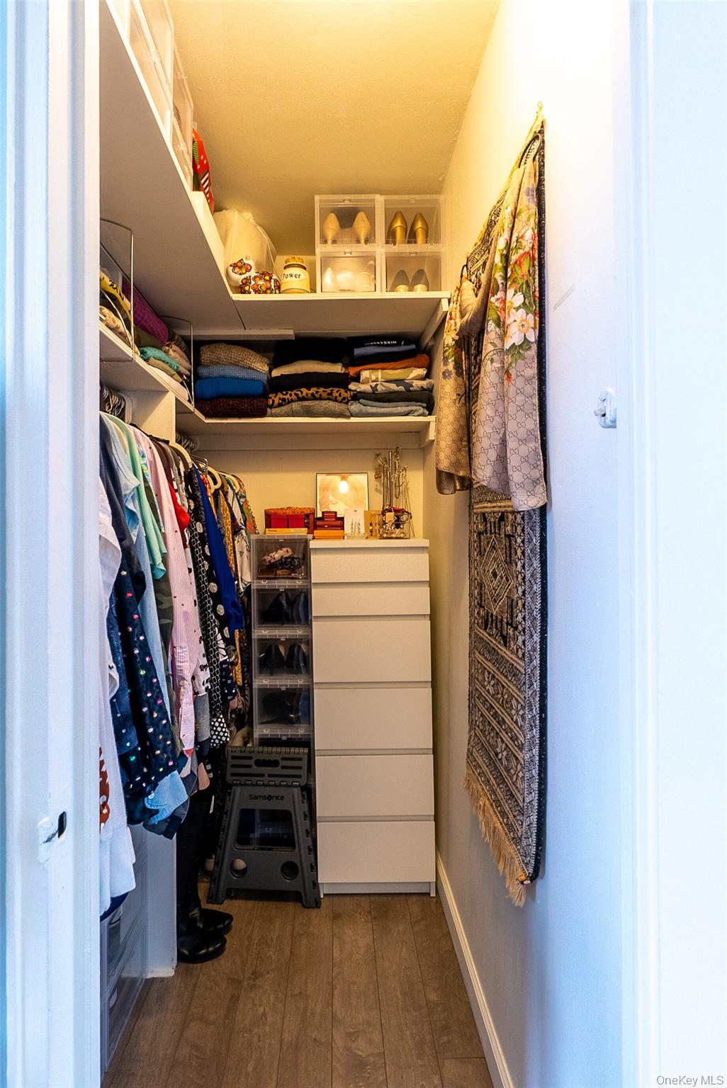 85-15 Main Street, Unit J12 Queens, NY 11435 - Photo 23 of 26 a view of walk in closet with clothes and shoes