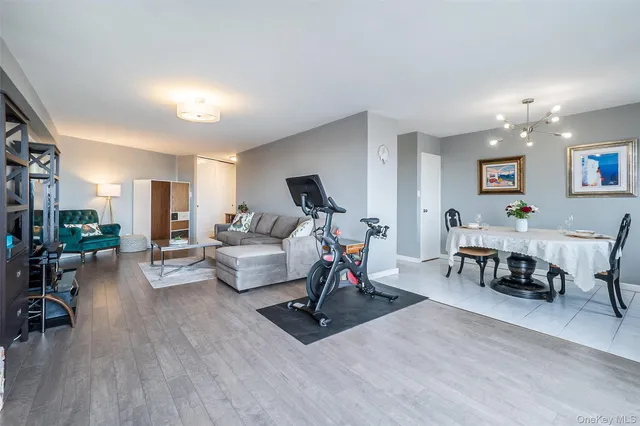 a view of a dining room with furniture and chandelier