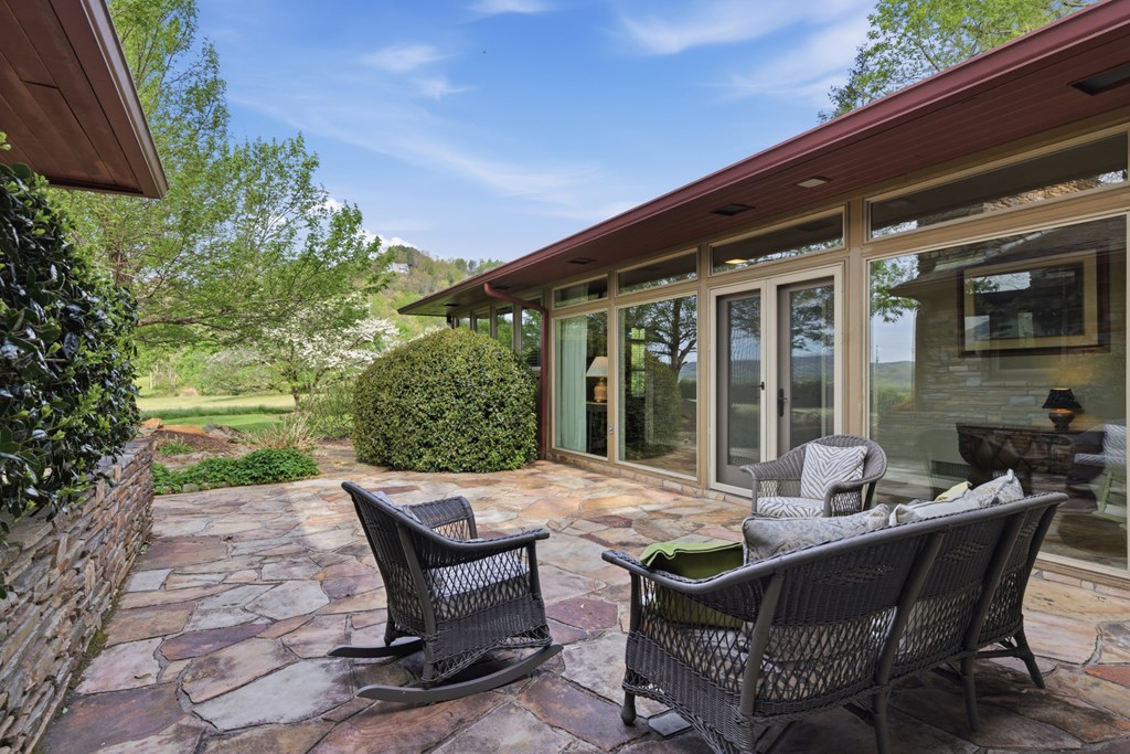 6203 Airport Road Andrews, NC 28901 - Photo 18 of 50 a view of a patio with a table and chairs