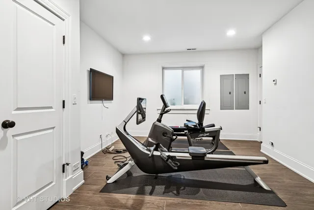 a view of a patio with fire pit and furniture