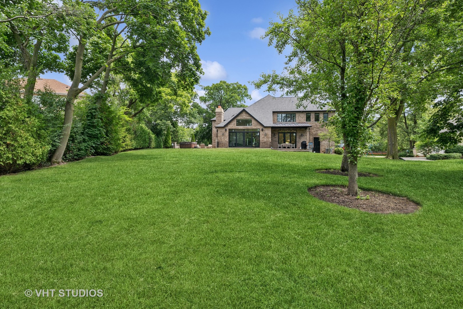 1200 Green Bay Road Glencoe, IL 60022 - Photo 28 of 33 a front view of a house with a yard and trees