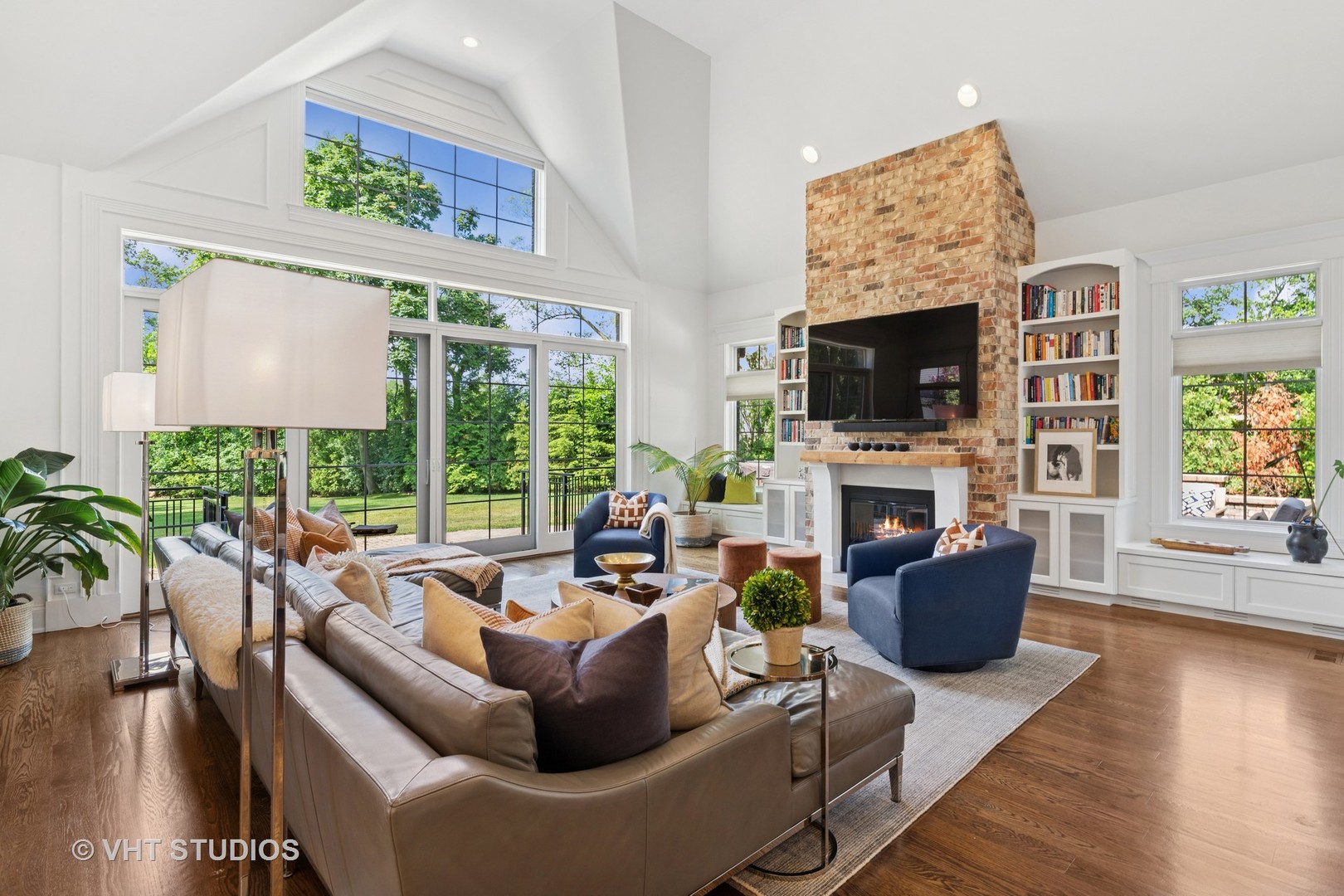 1200 Green Bay Road Glencoe, IL 60022 - Photo 4 of 33 a living room with furniture a flat screen tv and a fireplace