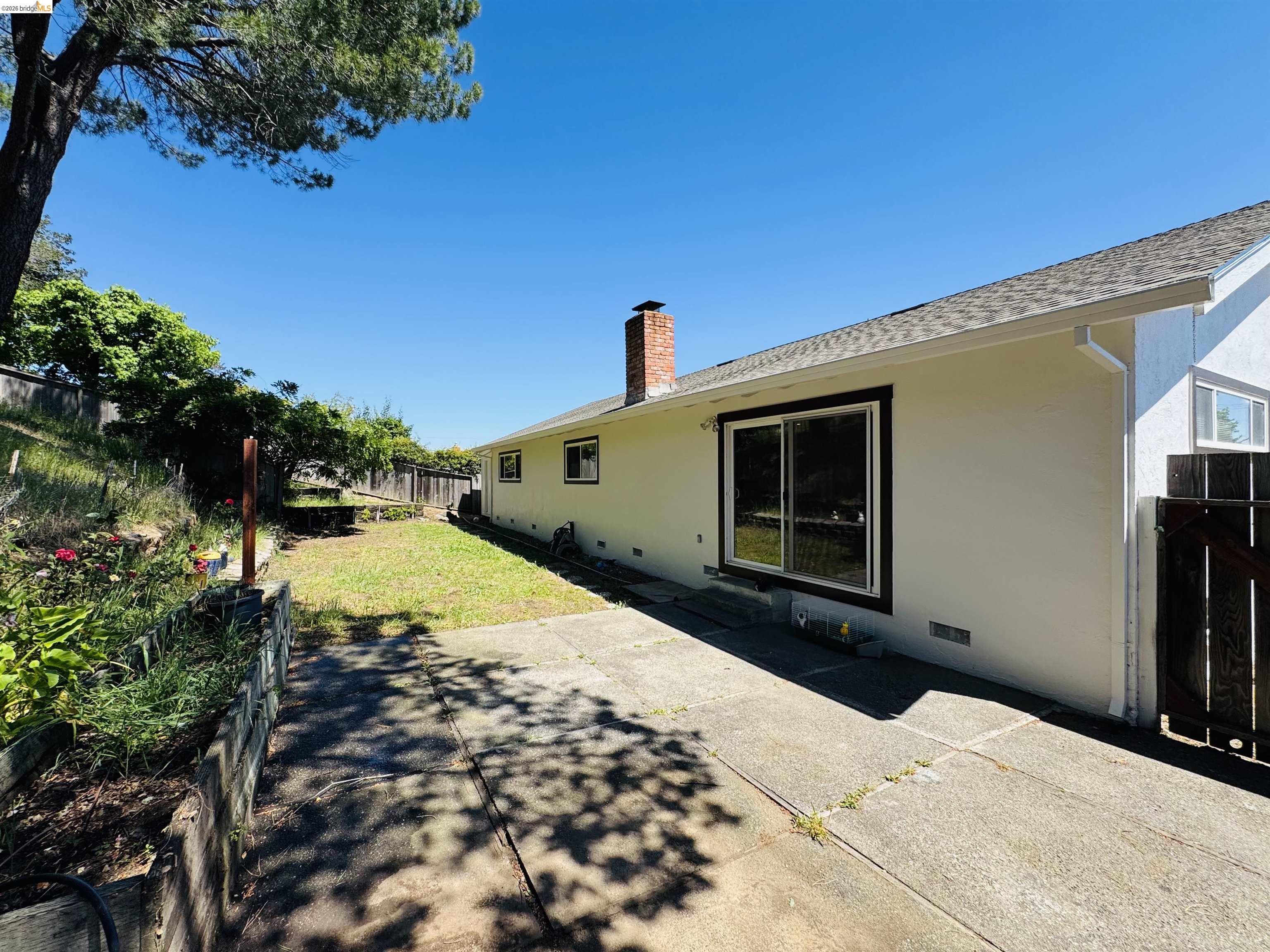 64 Washington Street Novato, CA 94947 - Photo 18 of 21 Exterior featuring a light-toned stucco finish, a brick chimney, and a shingled roof