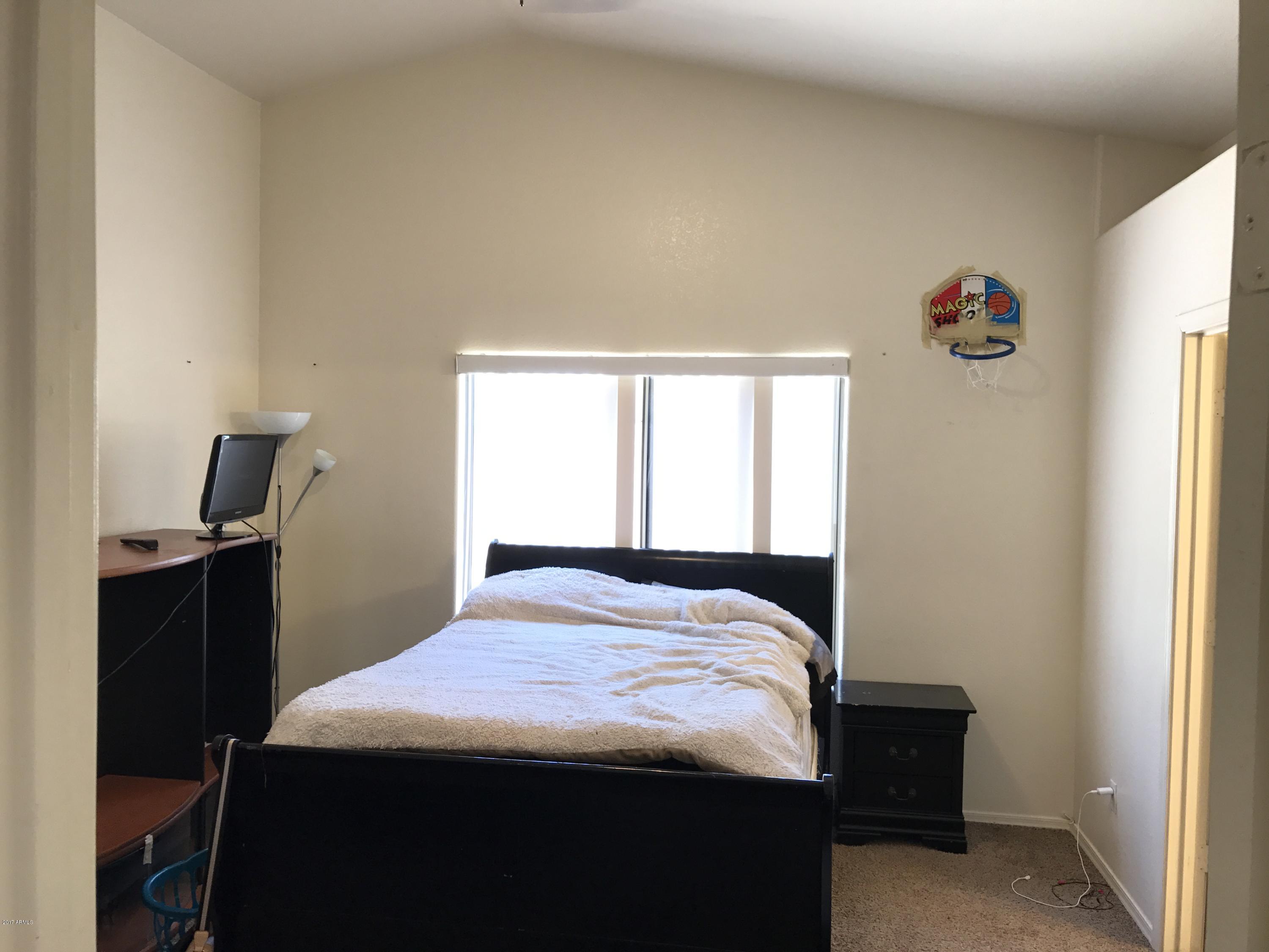 2214 West Vineyard Road Phoenix, AZ 85041 - Photo 13 of 19 Master bedroom