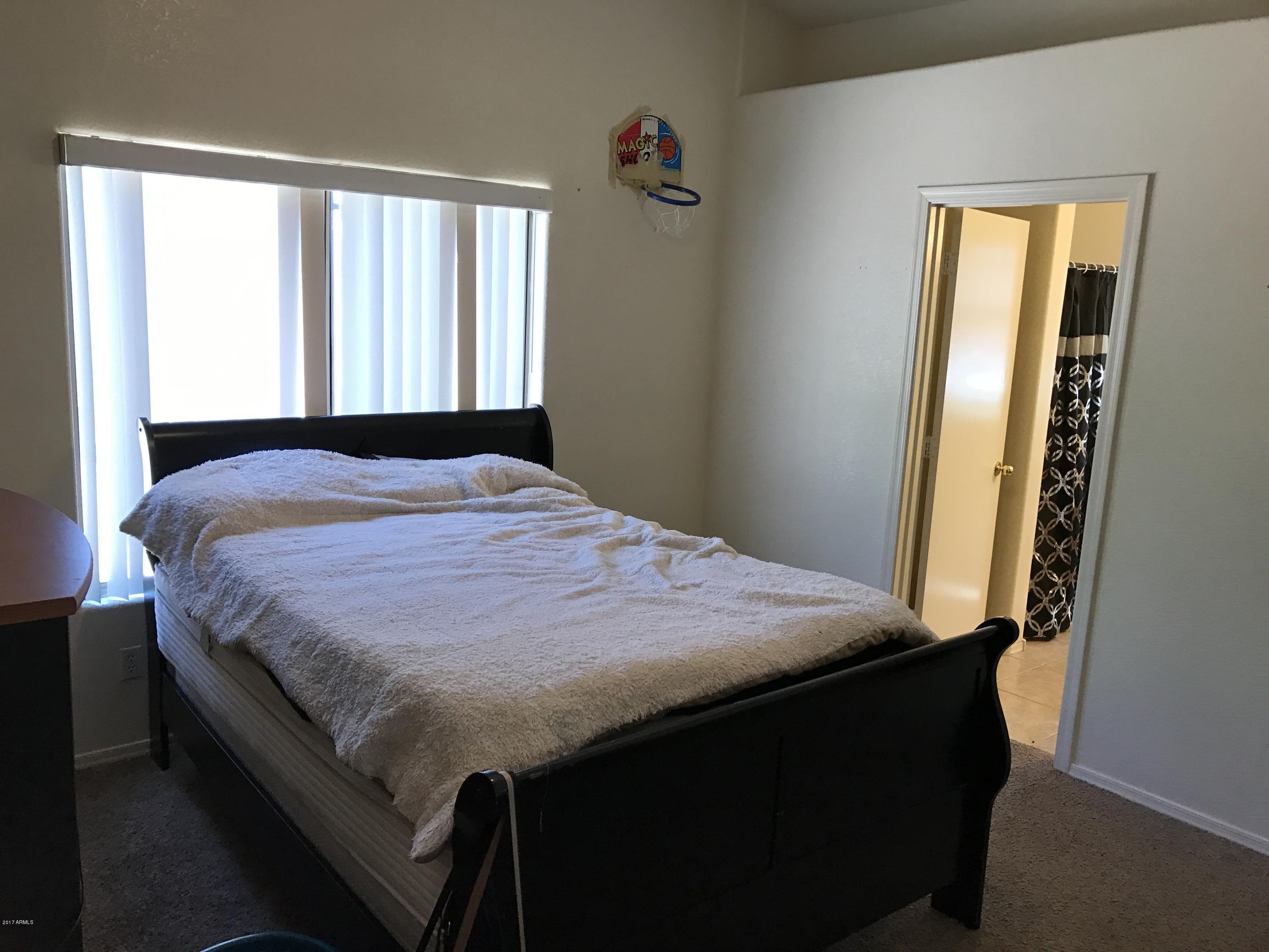2214 West Vineyard Road Phoenix, AZ 85041 - Photo 14 of 19 Master bedroom