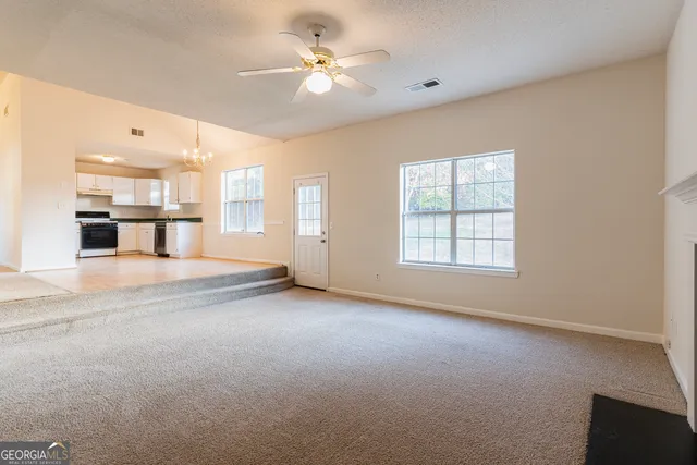 a view of a livingroom with a ceiling fan