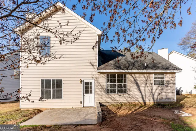 a house with a tree in the background