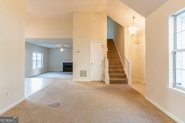 a view of a livingroom with a staircase