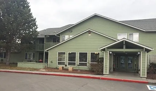 a front view of a house with a yard and porch
