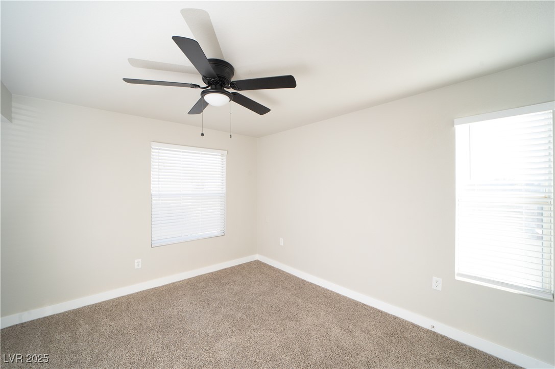 8101 West Flamingo Road, Unit 1057 Las Vegas, NV 89147 - Photo 16 of 38 Carpeted spare room with baseboards and ceiling fan