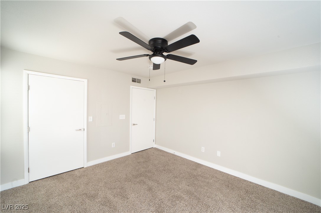 8101 West Flamingo Road, Unit 1057 Las Vegas, NV 89147 - Photo 18 of 38 Unfurnished bedroom with carpet floors and a ceiling fan