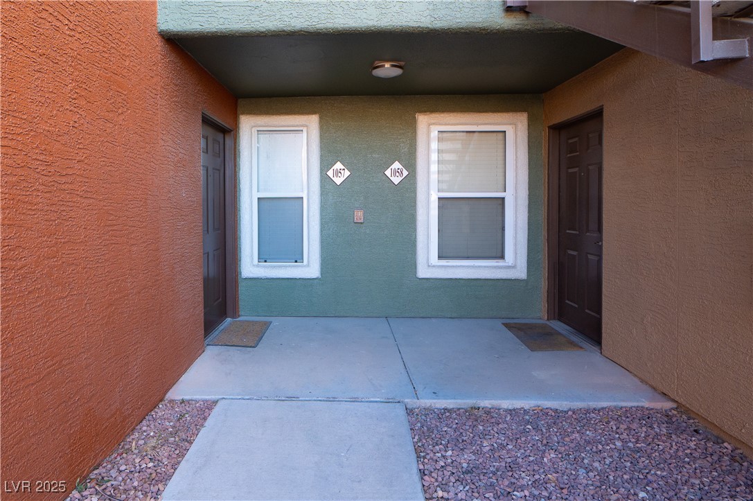 8101 West Flamingo Road, Unit 1057 Las Vegas, NV 89147 - Photo 23 of 38 View of exterior entry with a porch and stucco siding