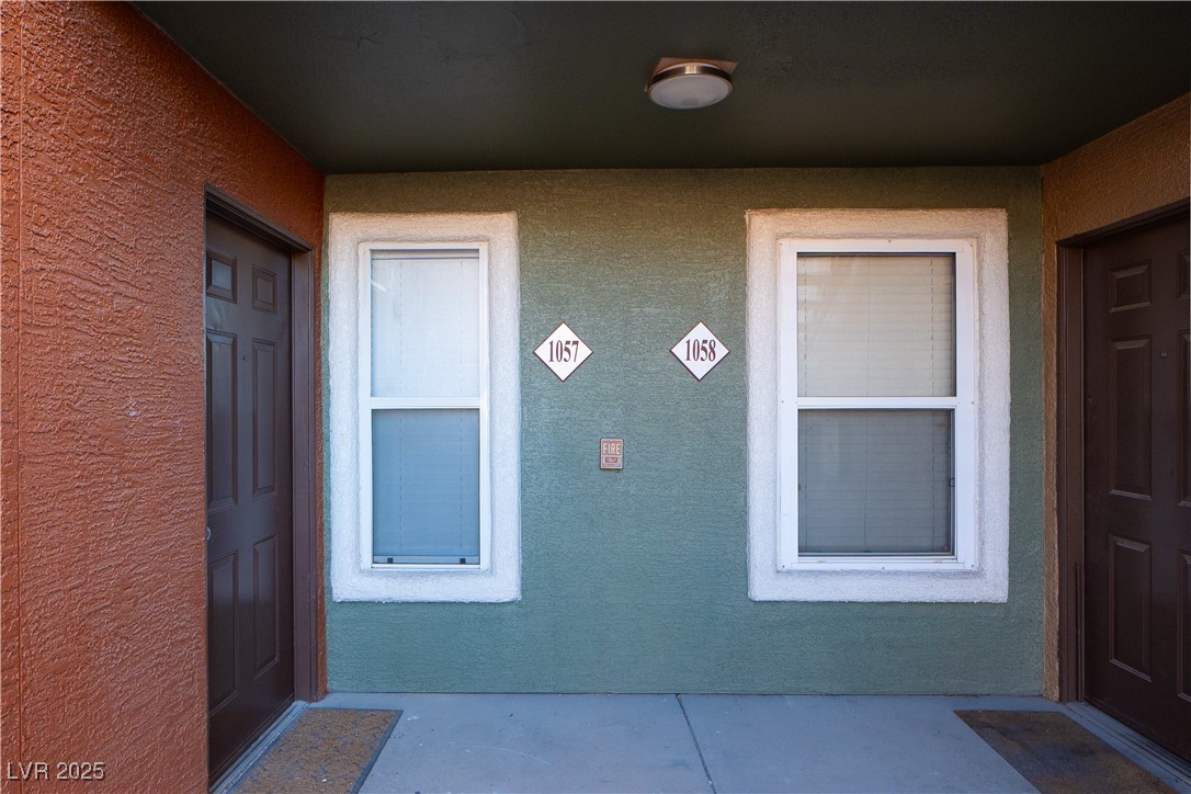 8101 West Flamingo Road, Unit 1057 Las Vegas, NV 89147 - Photo 24 of 38 View of exterior entry with stucco siding