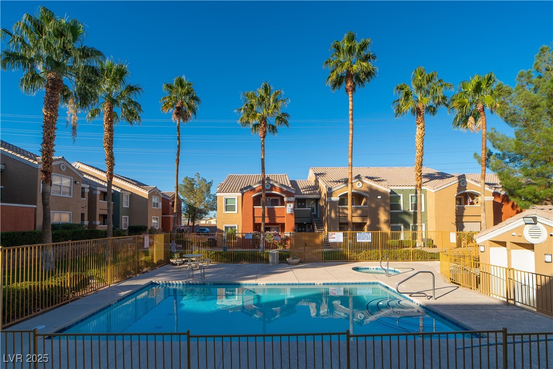 8101 West Flamingo Road, Unit 1057 Las Vegas, NV 89147 - Photo 34 of 38 Community pool with a patio area