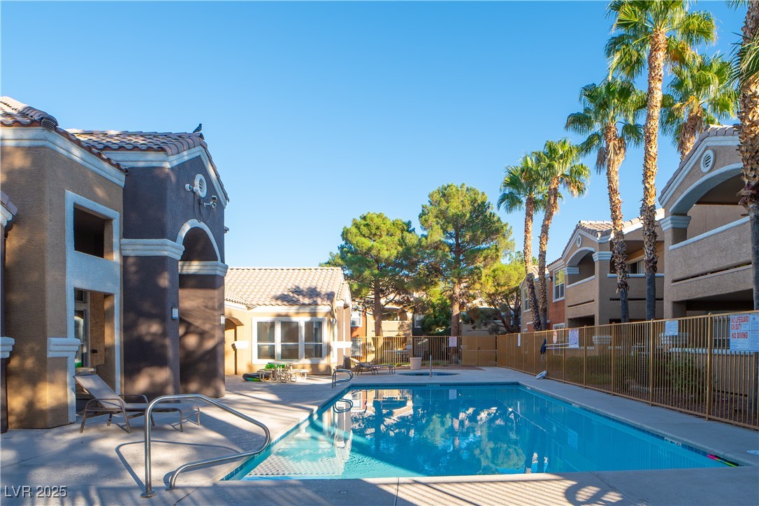 8101 West Flamingo Road, Unit 1057 Las Vegas, NV 89147 - Photo 38 of 38 Community pool featuring a patio