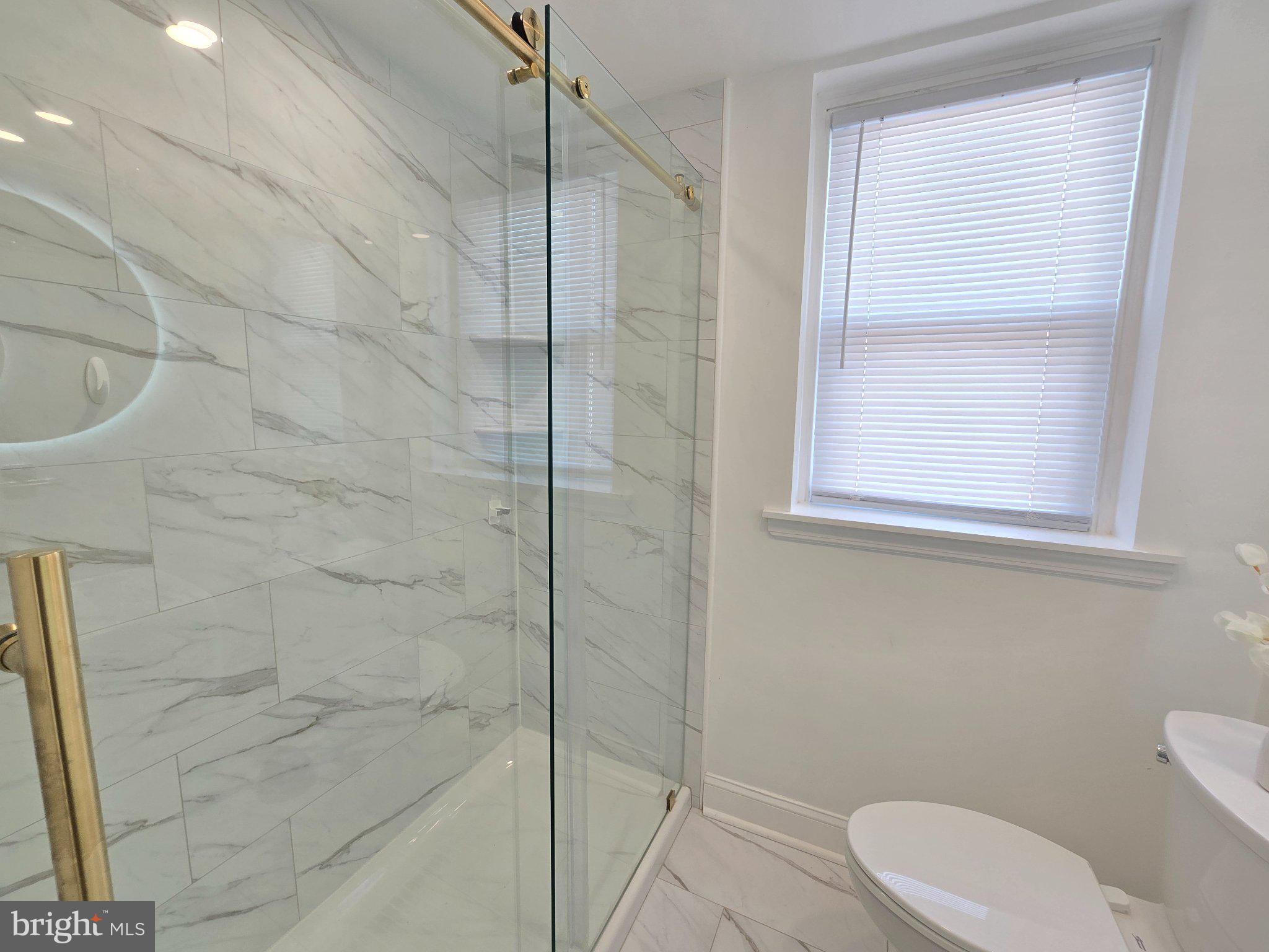 7638 Sherwood Road Philadelphia, PA 19151 - Photo 15 of 21 Sleek modern bathroom with elegance.