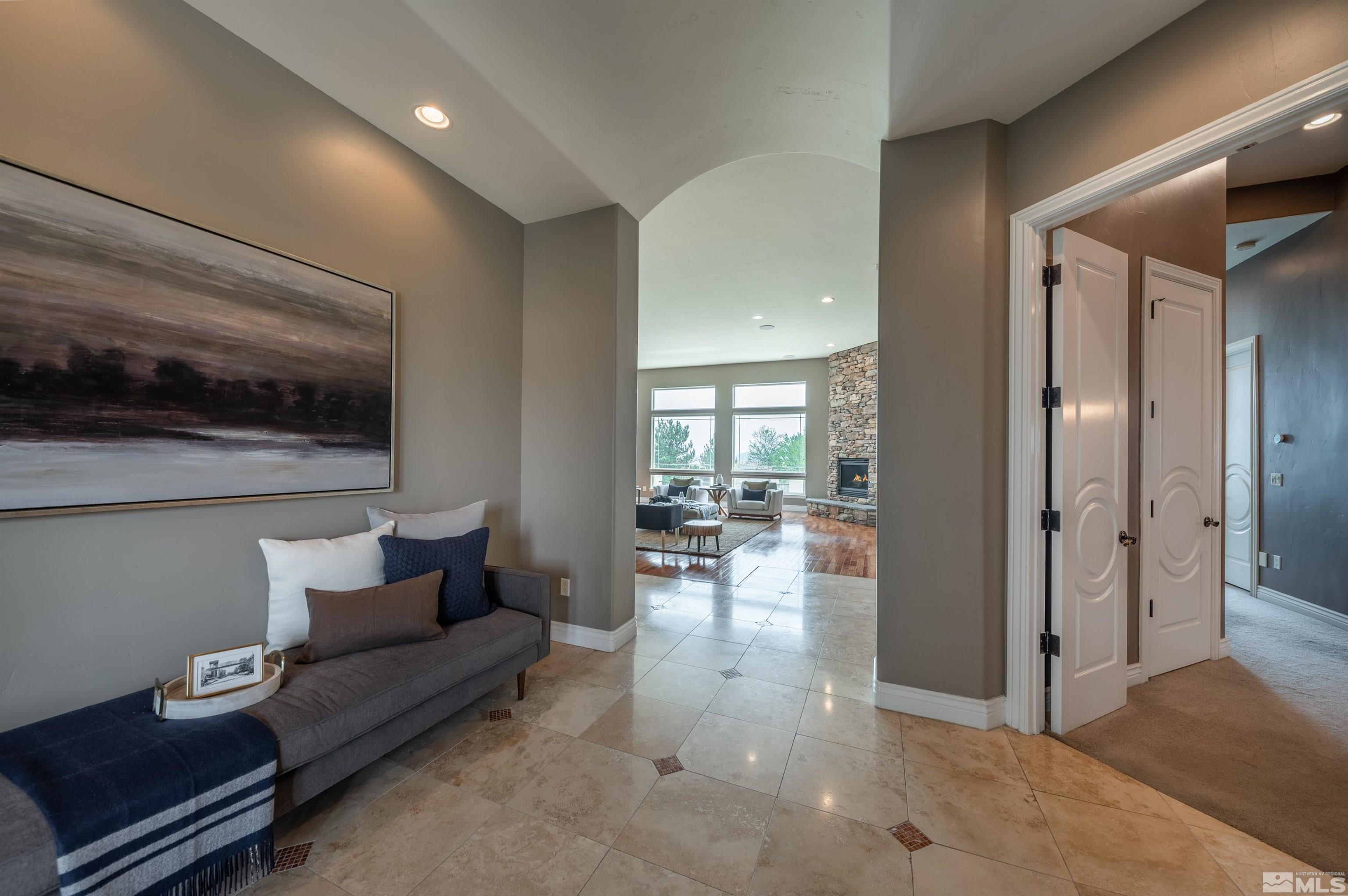12880 Silver Wolf Road Reno, NV 89511 - Photo 2 of 35 a living room with furniture and a flat screen tv