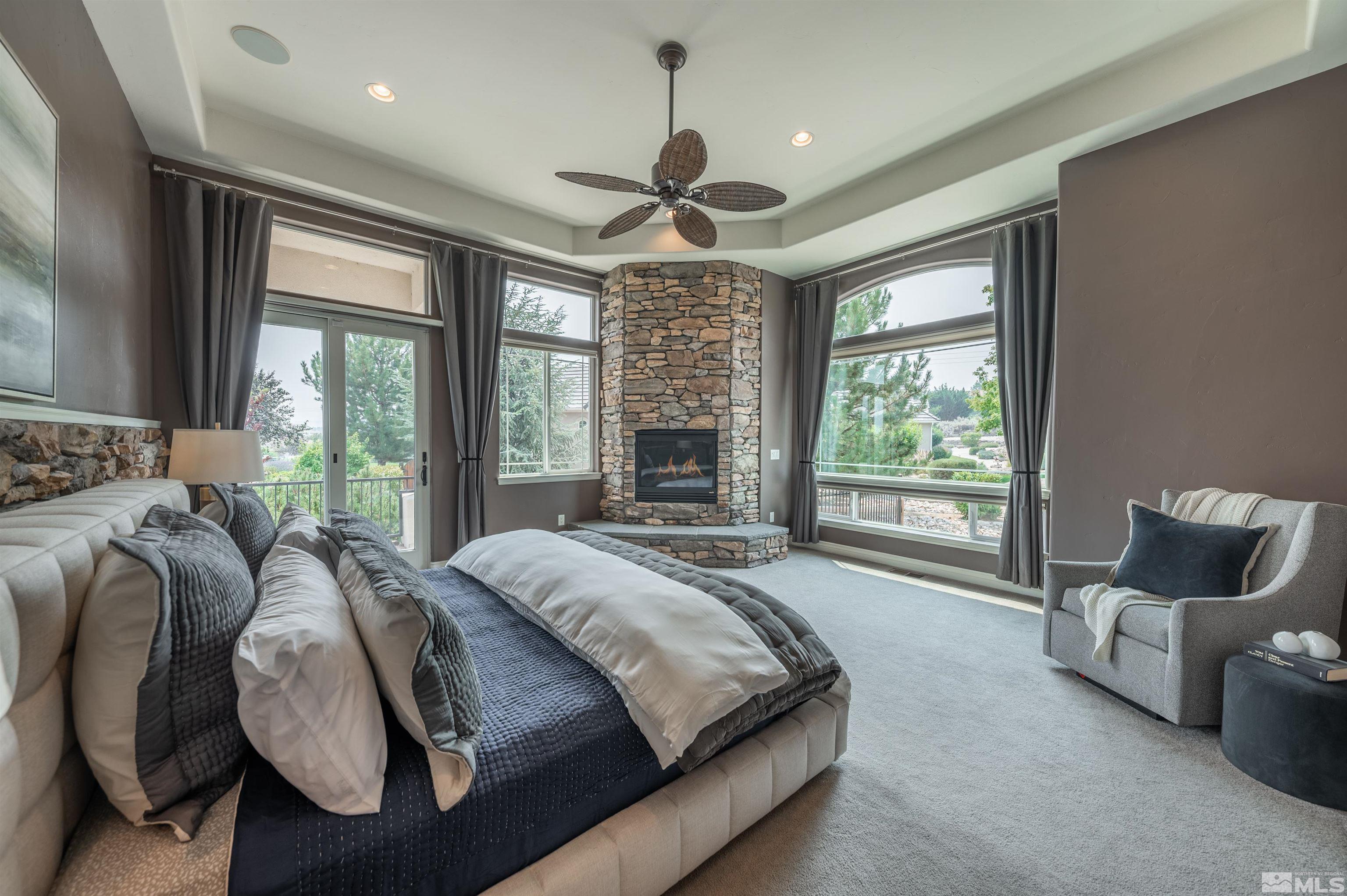12880 Silver Wolf Road Reno, NV 89511 - Photo 11 of 35 a bed sitting in a spacious bedroom next to a window