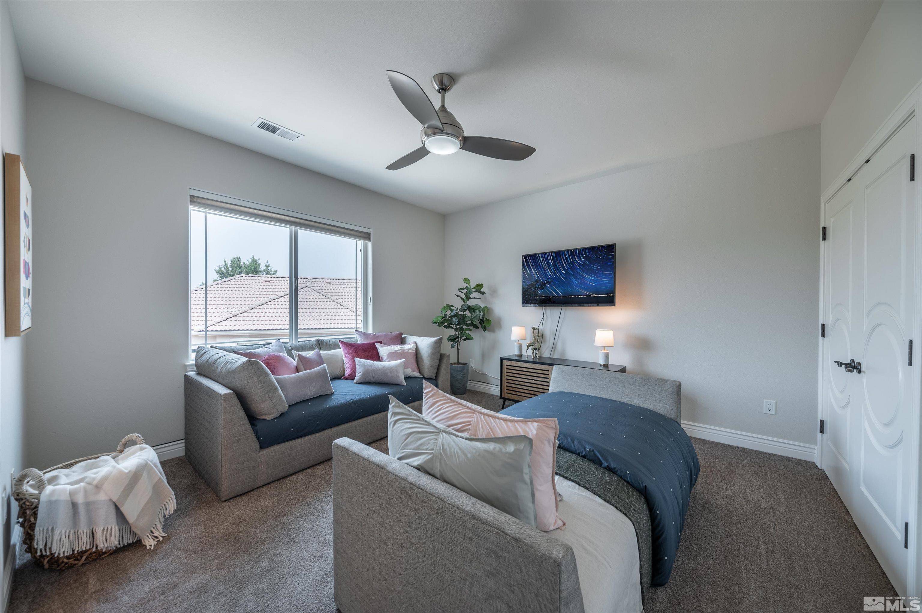 12880 Silver Wolf Road Reno, NV 89511 - Photo 19 of 35 a living room with furniture and a window