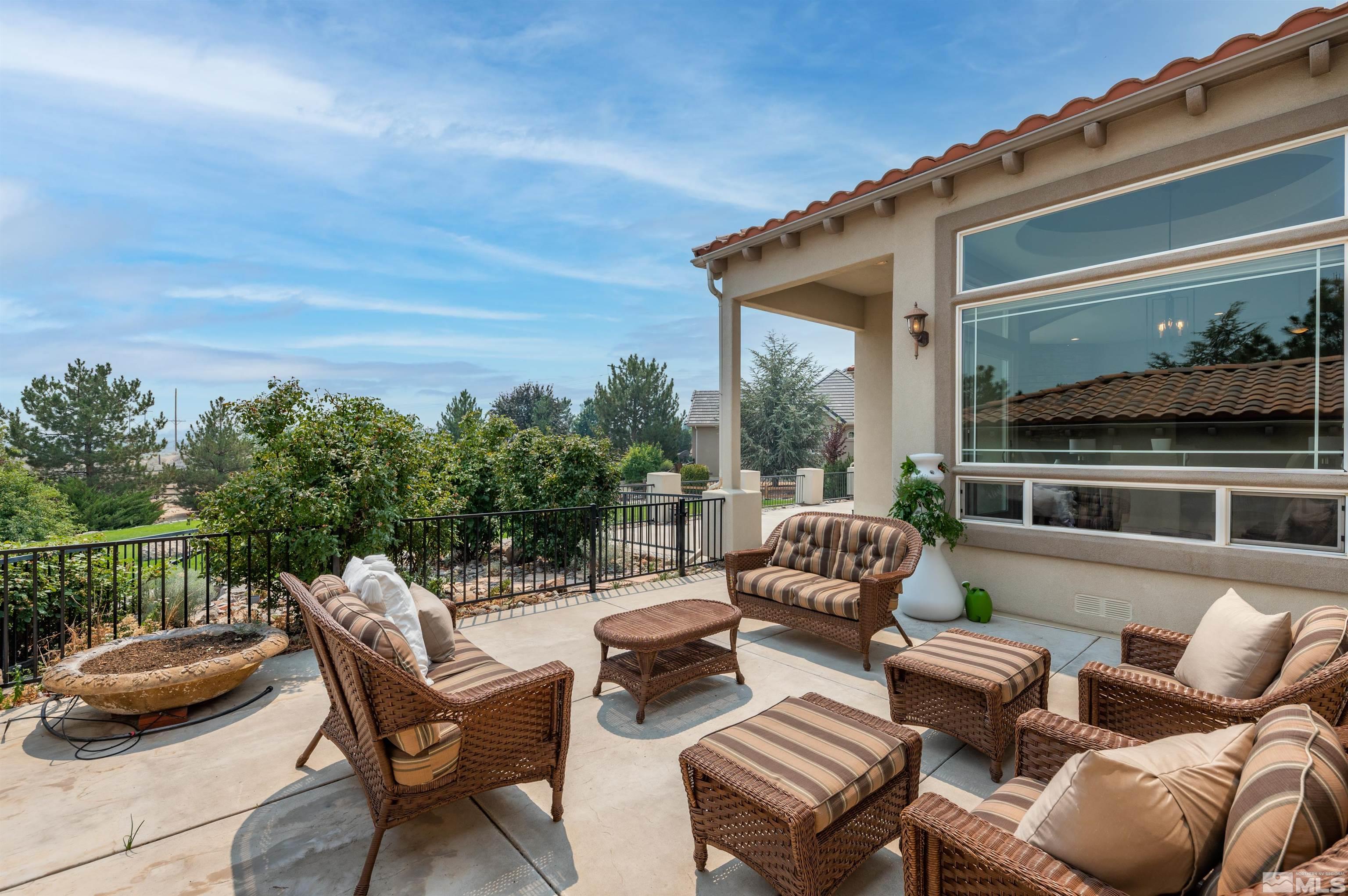 12880 Silver Wolf Road Reno, NV 89511 - Photo 22 of 35 a roof deck with couch and chairs