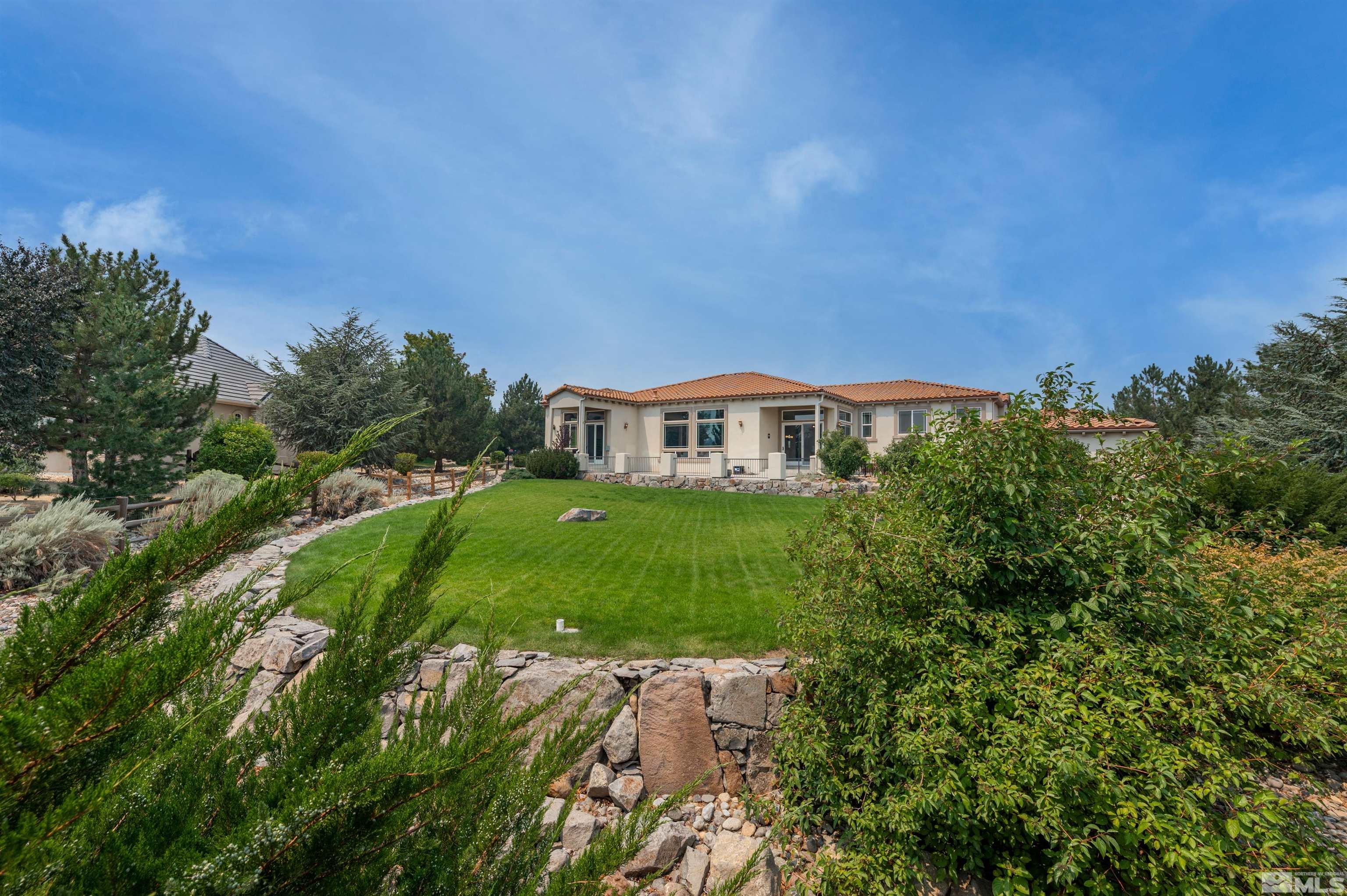 12880 Silver Wolf Road Reno, NV 89511 - Photo 25 of 35 a view of house with garden space and trees