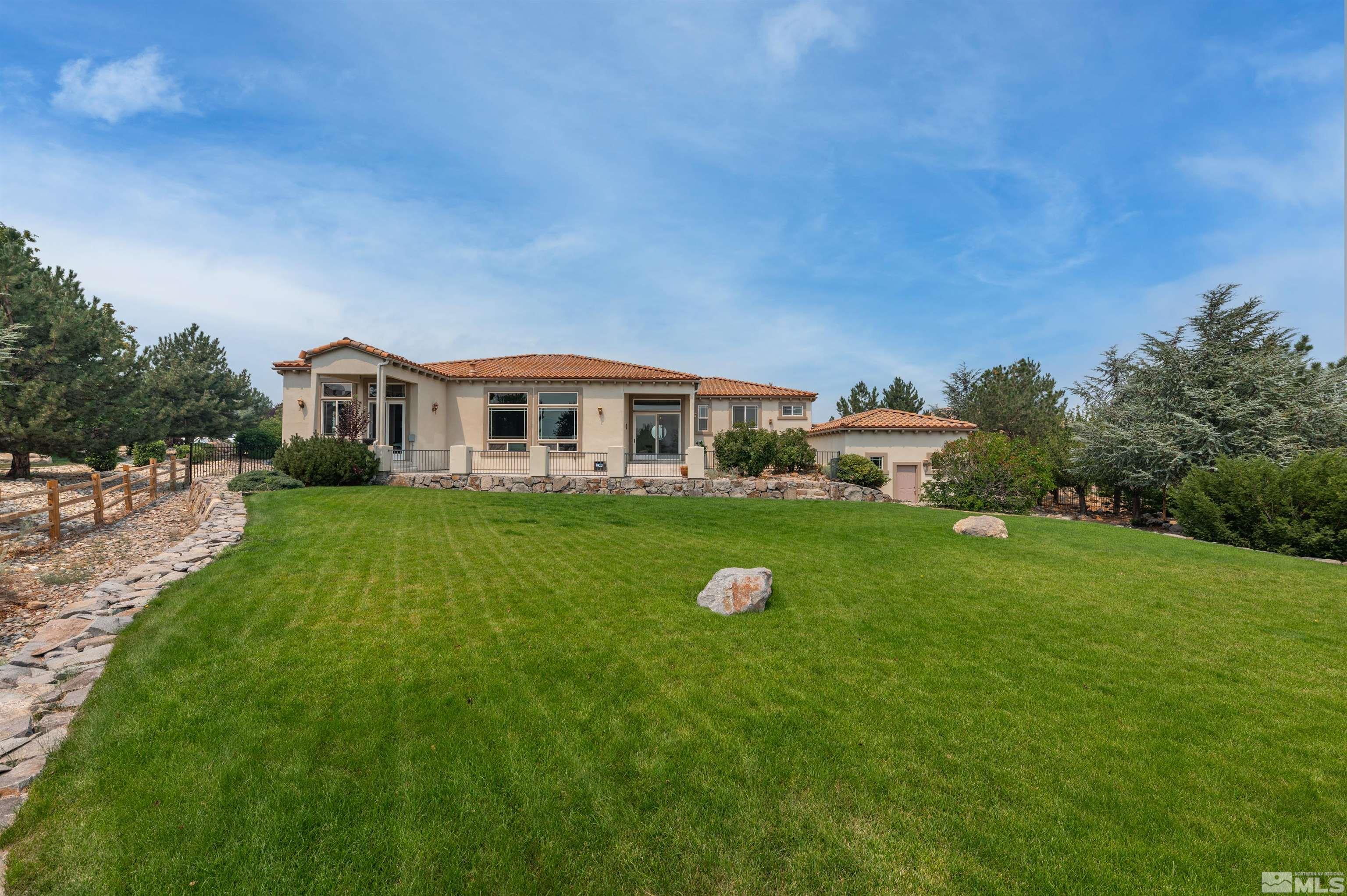 12880 Silver Wolf Road Reno, NV 89511 - Photo 26 of 35 a view of a house with a big yard