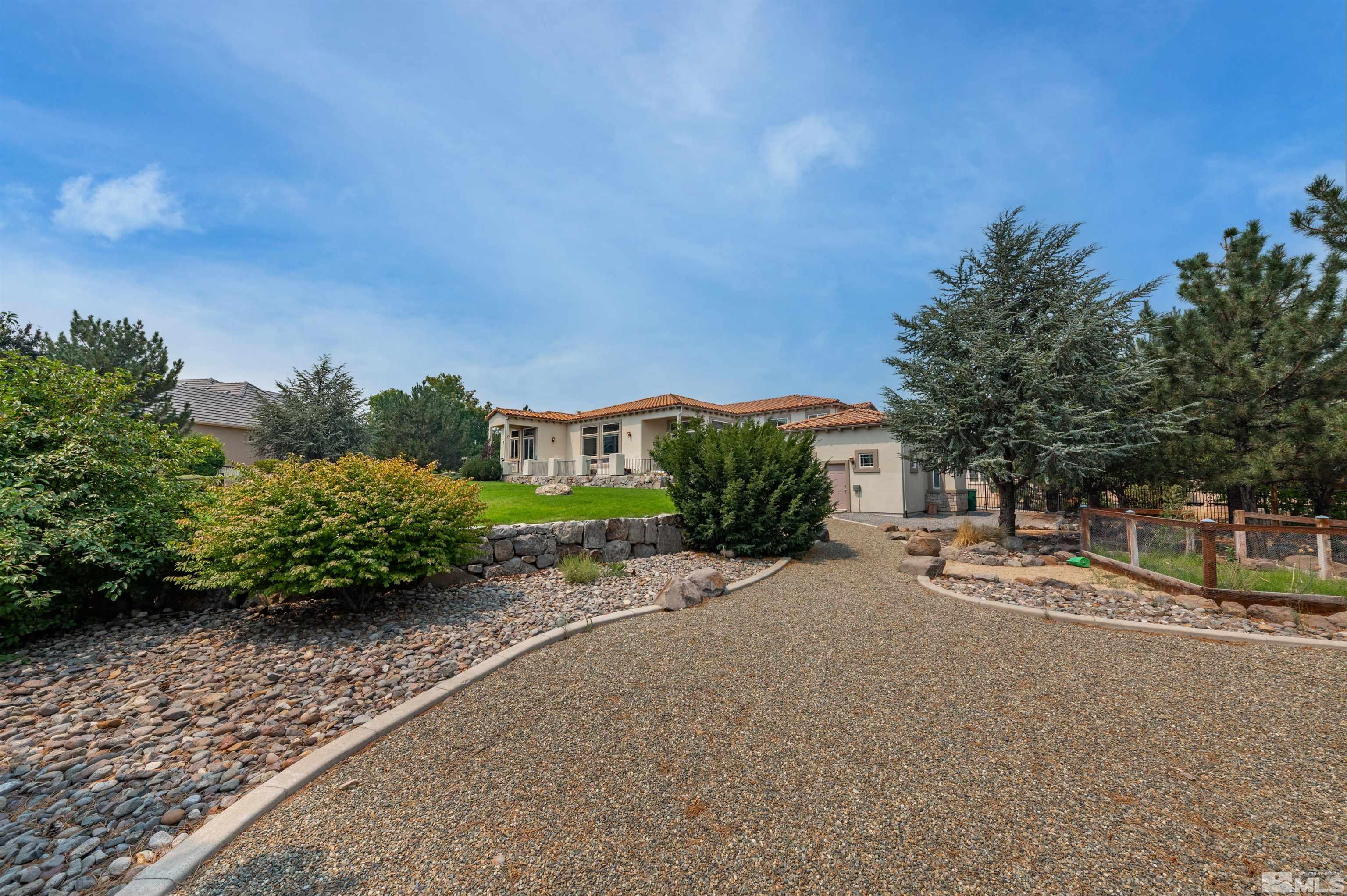 12880 Silver Wolf Road Reno, NV 89511 - Photo 27 of 35 a pathway with a house in the background