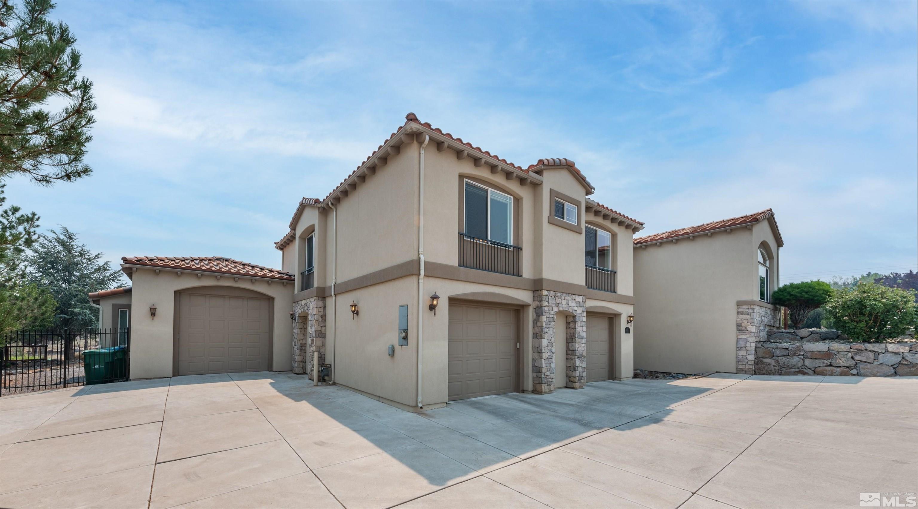 12880 Silver Wolf Road Reno, NV 89511 - Photo 31 of 35 a view of a house with a garage