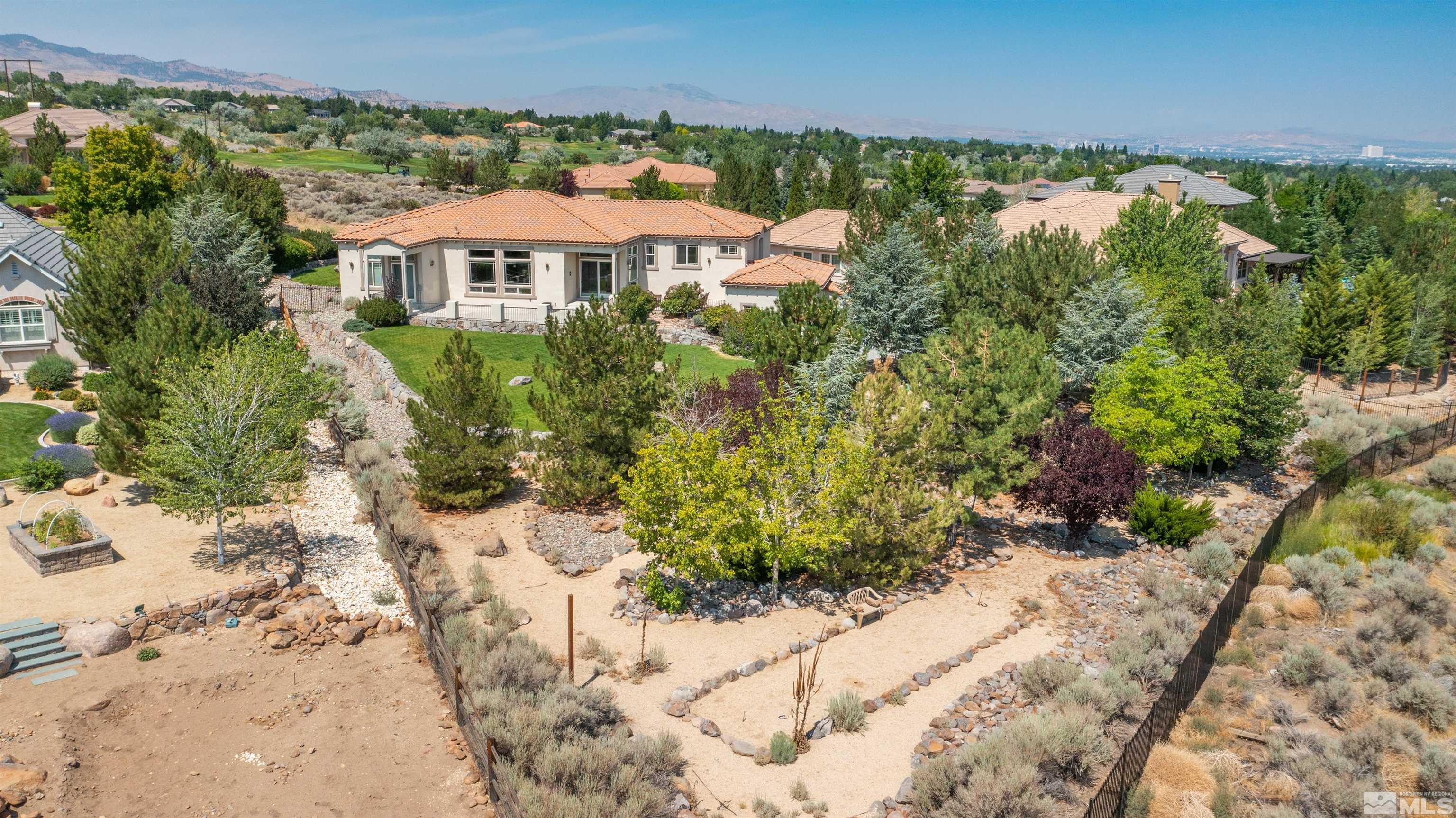 12880 Silver Wolf Road Reno, NV 89511 - Photo 33 of 35 a view of a patio with furniture and a yard