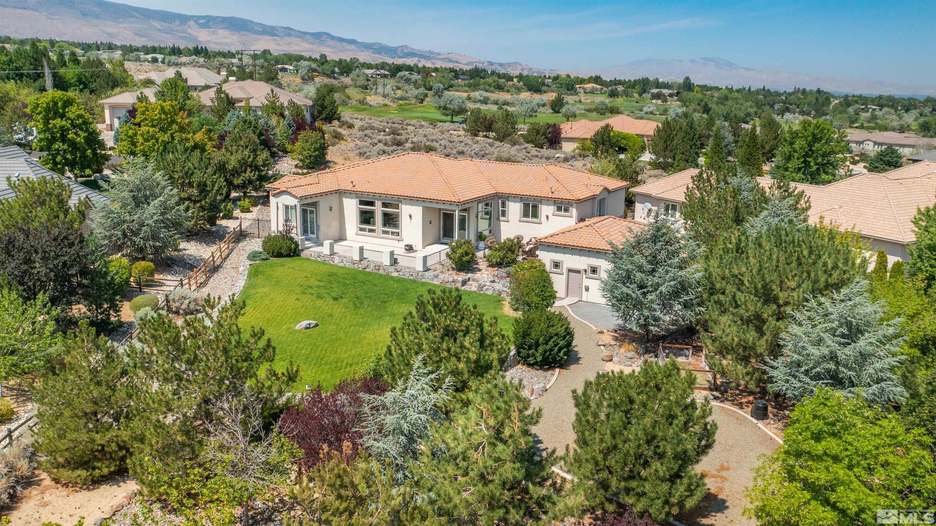 12880 Silver Wolf Road Reno, NV 89511 - Photo 34 of 35 an aerial view of a house with yard and outdoor seating