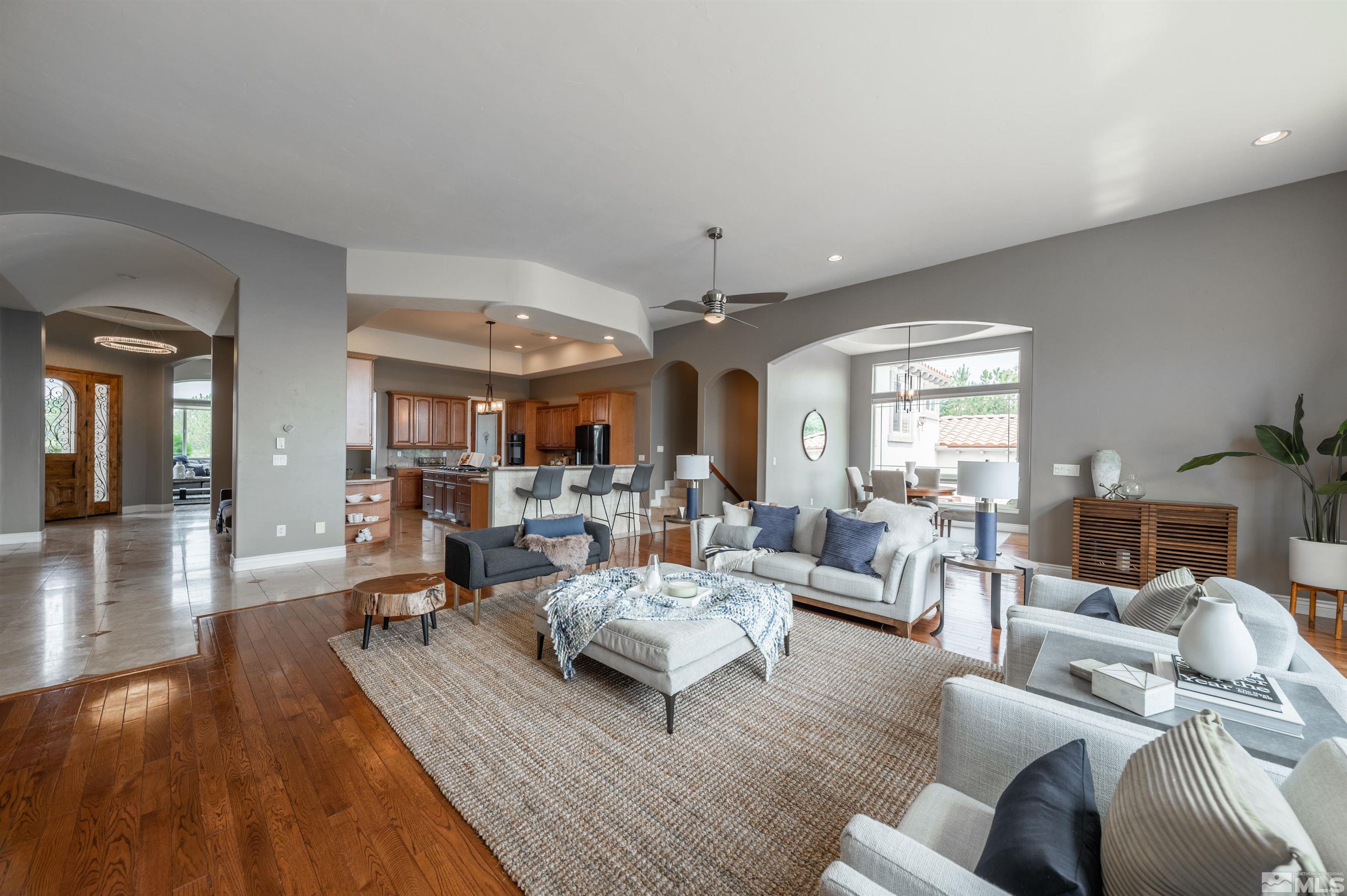 12880 Silver Wolf Road Reno, NV 89511 - Photo 6 of 35 a living room with furniture and a large window