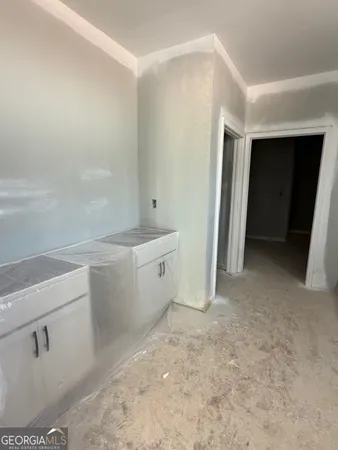 a kitchen with stainless steel appliances granite countertop a sink and a stove